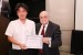 Dr. Nagib Callaos, General Chair, giving Dr. Naofumi Yoshida the best paper award certificate of the session "Interdisciplinary Research, Education, and Communication: Summer IDREC 2017 I." The title of the awarded paper is "A Multi-Disciplinary Approach of Business Architecture and its Business Intelligence Applications for IoT Big Data."
